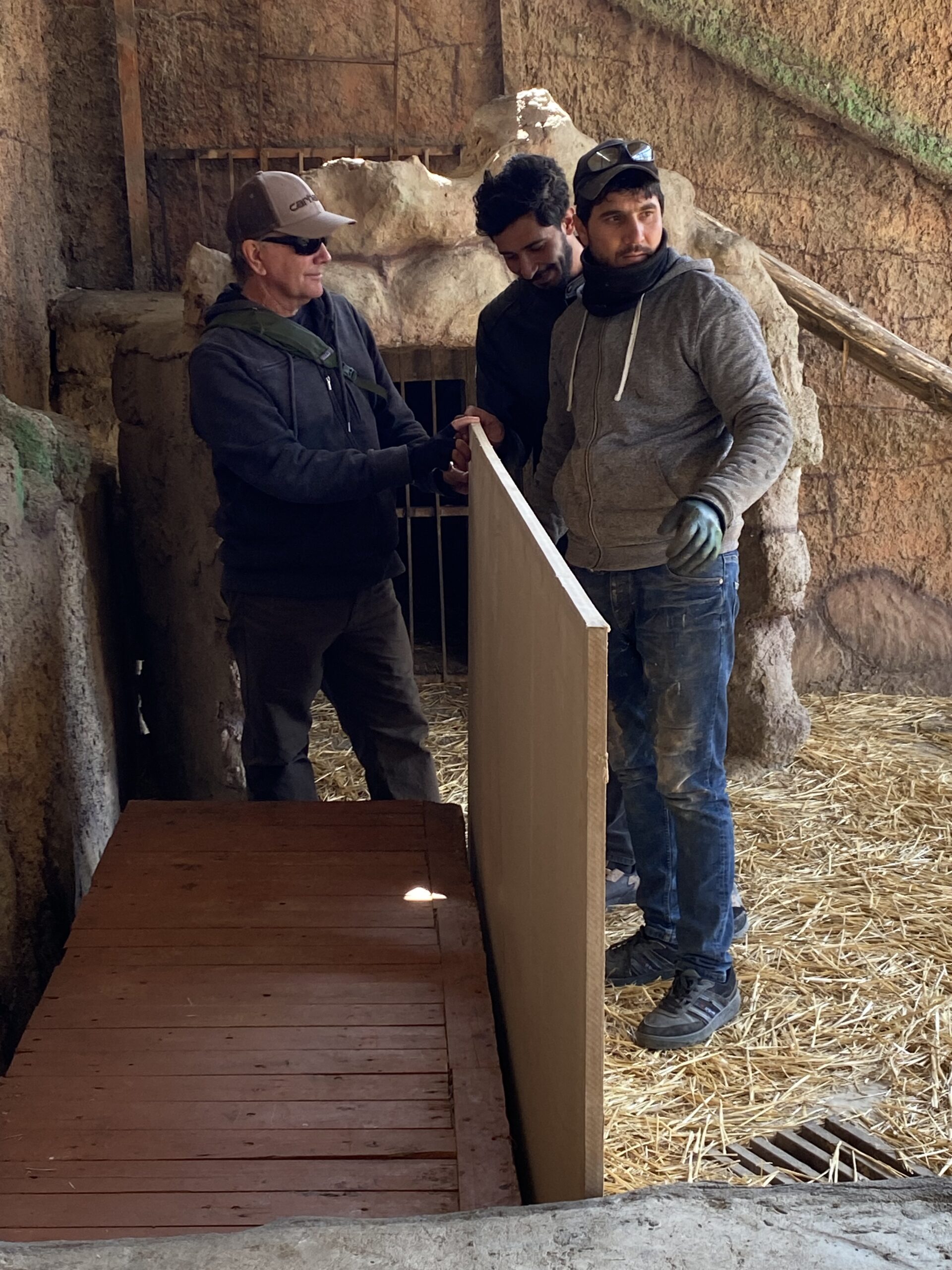 Andy and locals building enhancing Batifa's enclosure
